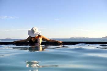 Pretty woman enjoying the swimming pool in Buzios, Brazil 