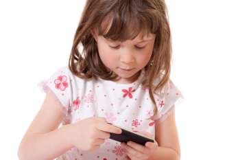 Cute little girl holding a portable video game 
