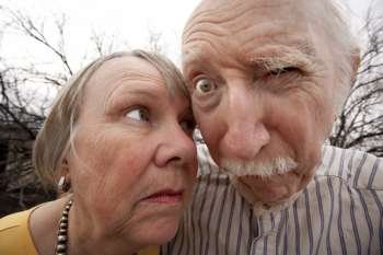 Closeup portrait of crazy elderly couple outdoors
