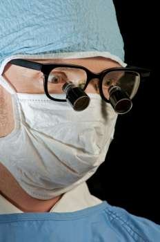 doctor in mask and glasses ready for surgery 