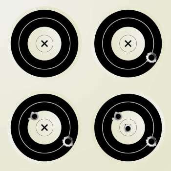 Collection of four targets with increasing amounts of bullet holes