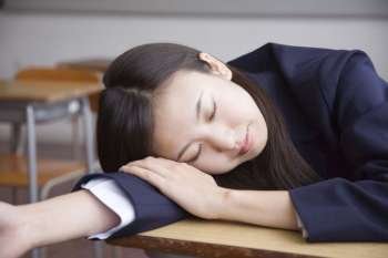 High school girl sleeping on a desk