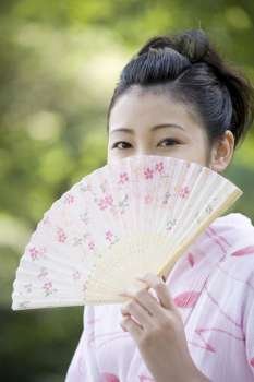 Japanese folding fan and yukata woman