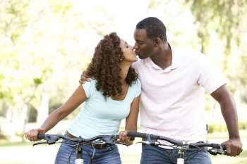 Couple On Cycle Ride in Park