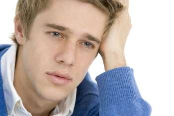 Head And Shoulders Of Thoughtful Young Man