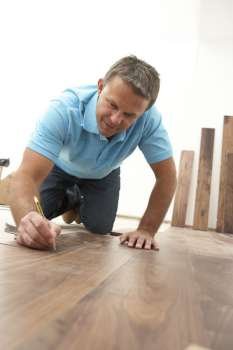 Builder Laying Wooden Flooring
