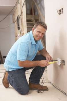 Electrician Installing Wall Socket