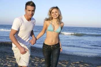 couple running at blue beach, young and beautiful