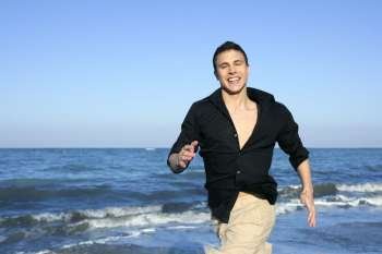 Man running happy on the blue summer beach, sunny summer