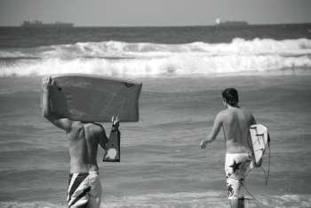 Surfers on Durban beach, South Africa