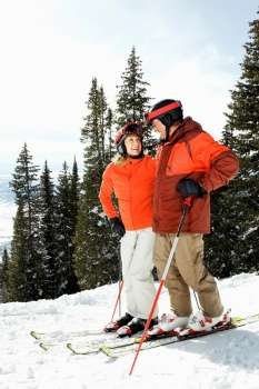 Couple on Skis on Mountain Slope