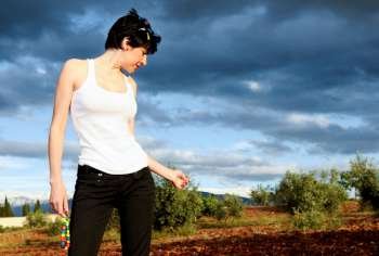 Woman in farm crop field  