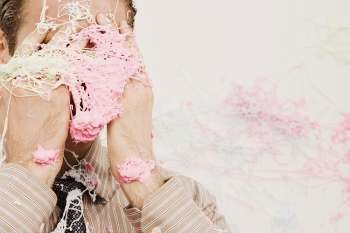 Close-up of a businessman covered with silly string