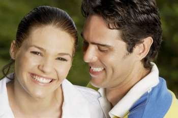 Portrait of a teenage girl and a young man smiling