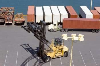 High angle view of cargo containers and a crane at a commercial dock