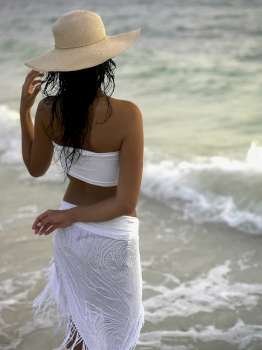 Rear view of a young woman wearing a sun hat