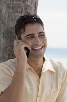 Close-up of a young man using a mobile phone