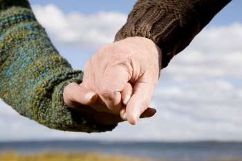 Close-up of a couple holding hands of each other