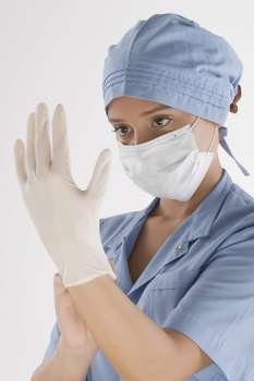 Female surgeon holding a syringe