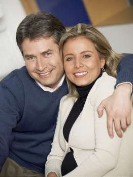 Portrait of a mature man and a mid adult woman smiling together