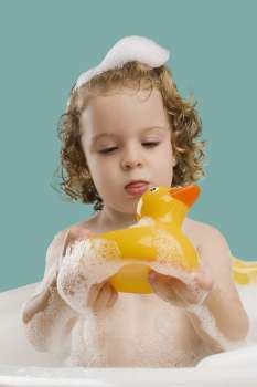 Close-up of a girl holding a rubber duck