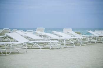 Empty lounge chairs on the beach