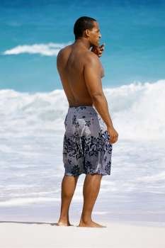 Rear view of man in trunks, Horse-shoe Bay beach, Bermuda