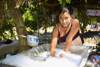 Portrait of a young woman washing clothes, Papantla, Veracruz, Mexico