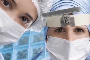 Two female surgeons in an operating room