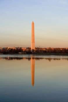 Reflection of a monument in water, Washington Monument, Washington DC, USA