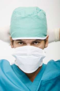 Portrait of a surgeon wearing a surgical mask on his face