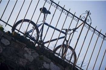 Low angle view of a bicycle leaning against a railing