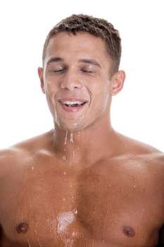 Close-up of a young man with water dripping from his face