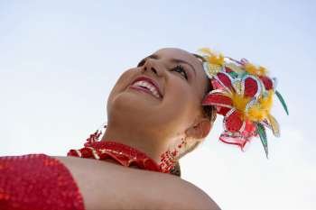 Low angle view of a teenage girl wearing a costume in a traditional festival