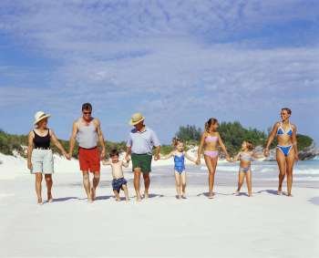 Three generation family walking on the beach with holding hands, Bermuda