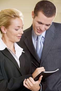 Close-up of a businesswoman talking to a businessman
