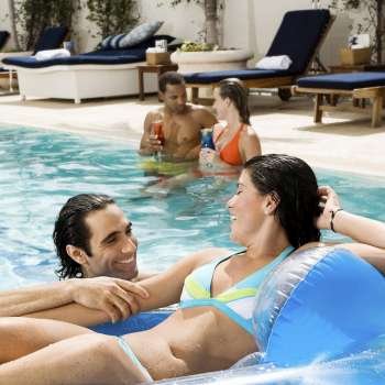 Two couples in a swimming pool