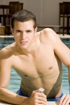 Portrait of a young man in a swimming pool