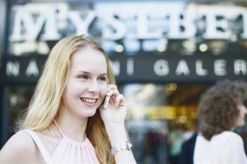 Close-up of a young woman talking on a mobile phone 