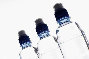 Close-up of three water bottles