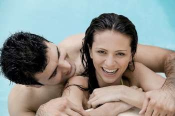 Close-up of a young couple in a swimming pool
