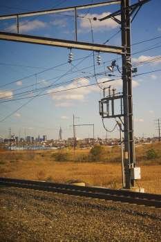 Electricity pylon at a railroad track