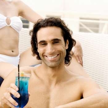 Portrait of a mid adult man holding a cocktail