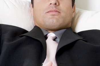 Close-up of a businessman lying down