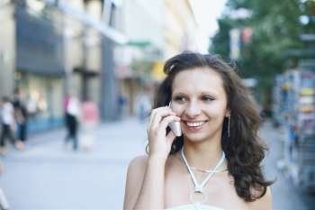 Close-up of a young woman talking on a mobile phone 