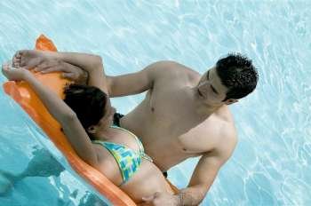 High angle view of a young couple in a swimming pool