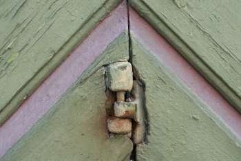 Close-up of a hinge on an old door