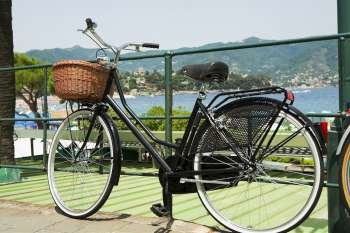 Bicycle leaning against a railing, Italian Riviera, Santa Margherita Ligure, Genoa, Liguria, Italy