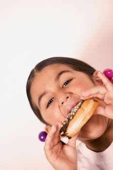 Portrait of a girl eating a donut