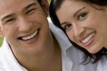 Portrait of a young couple smiling together